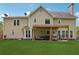Spacious backyard with a covered patio and a well-manicured lawn at 75 Hunters Ct, Dallas, GA 30157