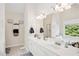 Bright bathroom with double vanity, large mirror, and separate tub and shower at 75 Hunters Ct, Dallas, GA 30157