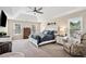 Spacious bedroom featuring a tray ceiling, ceiling fan, and multiple windows providing natural light at 75 Hunters Ct, Dallas, GA 30157