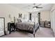 Cozy bedroom featuring a ceiling fan, decorative initial art, and comfortable furnishings at 75 Hunters Ct, Dallas, GA 30157