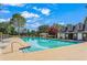 Community pool and pool house under a blue sky with plenty of chairs for residents to enjoy at 75 Hunters Ct, Dallas, GA 30157