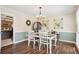 Well-lit dining room with modern furnishings, including a table set for four and stylish decor at 75 Hunters Ct, Dallas, GA 30157