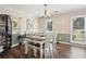 Bright dining room featuring a stylish chandelier, elegant decor, and a view of the outdoor scenery at 75 Hunters Ct, Dallas, GA 30157
