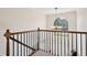 Elegant foyer with a wrought iron banister, chandelier, and large window providing ample natural light at 75 Hunters Ct, Dallas, GA 30157