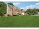Beautiful two-story brick home with an attached two-car garage, situated on a spacious, well-maintained lawn at 75 Hunters Ct, Dallas, GA 30157