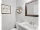 Modern half bathroom with a sleek vanity, contemporary mirror, and stylish decor for a touch of elegance at 75 Hunters Ct, Dallas, GA 30157