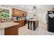 Spacious kitchen with wooden cabinets, granite countertops, stainless appliances, and an island with breakfast bar at 75 Hunters Ct, Dallas, GA 30157