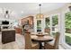 Bright kitchen features a breakfast nook, wooden cabinets, stainless appliances, and views of the backyard at 75 Hunters Ct, Dallas, GA 30157