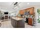 Open kitchen with wooden cabinets, granite countertops, stainless appliances, and an island with storage space at 75 Hunters Ct, Dallas, GA 30157