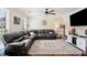 Cozy living room featuring a comfortable sectional sofa, modern entertainment center, and bright natural light at 75 Hunters Ct, Dallas, GA 30157