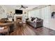 Cozy living room boasts a fireplace, built-in shelving, ceiling fan, and comfortable sofas for relaxation at 75 Hunters Ct, Dallas, GA 30157