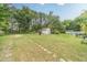 Large backyard featuring a pool and plenty of green space at 123 Chippewa Run, Auburn, GA 30011