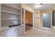 Bright dining area with tile flooring, a built-in bookshelf, and easy access to the living room at 123 Chippewa Run, Auburn, GA 30011