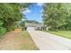 Attractive single-story home featuring a long driveway, attached two-car garage, and a well-maintained lawn at 123 Chippewa Run, Auburn, GA 30011