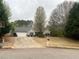 Charming single story home featuring an attached garage, long driveway, and a traditional landscaped front yard at 123 Chippewa Run, Auburn, GA 30011