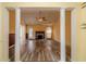 Spacious living room with hardwood floors, a fireplace, and classic architectural columns at 123 Chippewa Run, Auburn, GA 30011
