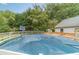 Backyard featuring large above ground pool, deck, slide and basketball court at 123 Chippewa Run, Auburn, GA 30011