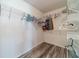 Empty walk-in closet with wire shelving and wood-look floors is ready to be organized at 123 Chippewa Run, Auburn, GA 30011