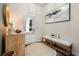 Inviting entryway with a round area rug, bench, and decor at 128 Madison Bnd, Woodstock, GA 30188