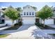 Inviting townhome with a well-maintained front yard and a two-car garage at 128 Madison Bnd, Woodstock, GA 30188