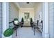 Cozy front porch with seating, plants, and stylish decor at 128 Madison Bnd, Woodstock, GA 30188