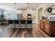 Modern kitchen with stainless steel appliances, granite countertops, and island seating at 128 Madison Bnd, Woodstock, GA 30188