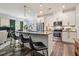 Bright, open kitchen with a large island, stainless steel appliances, and stylish pendant lighting at 128 Madison Bnd, Woodstock, GA 30188
