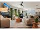 Bright living room with a fireplace, piano, comfortable seating, and stylish decor at 128 Madison Bnd, Woodstock, GA 30188