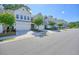Neighborhood street featuring well-maintained townhomes and community landscaping at 128 Madison Bnd, Woodstock, GA 30188