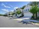 Charming townhome community with beautiful landscaping and ample parking at 128 Madison Bnd, Woodstock, GA 30188