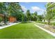 Expansive backyard featuring lush artificial turf, a covered patio, and ample space for outdoor enjoyment at 2660 Peachtree Rd # 6A, Atlanta, GA 30305