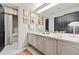 Bright bathroom featuring a dual vanity, and framed wall art creating a functional and stylish space at 2660 Peachtree Rd # 6A, Atlanta, GA 30305