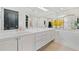 Bright bathroom featuring a dual vanity, soaking tub, and large mirrors, providing an open and luxurious feel at 2660 Peachtree Rd # 6A, Atlanta, GA 30305