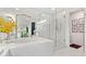 This bathroom offers a stylish soaking tub and a glass-enclosed shower, providing a relaxing and luxurious experience at 2660 Peachtree Rd # 6A, Atlanta, GA 30305