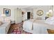 Comfortable bedroom featuring neutral tones, an accent rug, and a wardrobe for ample storage at 2660 Peachtree Rd # 6A, Atlanta, GA 30305