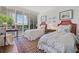 Charming bedroom featuring two twin beds, bright window views, and a decorative rug, creating a cozy space at 2660 Peachtree Rd # 6A, Atlanta, GA 30305