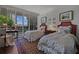Bedroom featuring large windows with blinds and two beds at 2660 Peachtree Rd # 6A, Atlanta, GA 30305