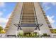 Impressive exterior of a modern high-rise building against a blue sky at 2660 Peachtree Rd # 6A, Atlanta, GA 30305