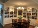 Dining room featuring a round table, four chairs, and built-in bookcases at 2660 Peachtree Rd # 6A, Atlanta, GA 30305