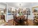 Charming dining room with built-in bookshelves, a crystal chandelier, and hardwood floors at 2660 Peachtree Rd # 6A, Atlanta, GA 30305