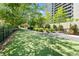 Well-maintained dog park featuring artificial turf and landscaping, providing a great space for pets and owners at 2660 Peachtree Rd # 6A, Atlanta, GA 30305