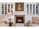 Living room fireplace with built-in shelving and a cozy seating arrangement at 2660 Peachtree Rd # 6A, Atlanta, GA 30305