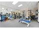 Well-equipped gym featuring weights, machines, and mirrored walls, perfect for a complete workout at 2660 Peachtree Rd # 6A, Atlanta, GA 30305