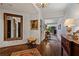 Long hallway with hardwood floors, elegant decor, and a glimpse into the living area at 2660 Peachtree Rd # 6A, Atlanta, GA 30305