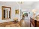 Beautiful hallway with dark wood floors, a decorative mirror, and an elegant table at 2660 Peachtree Rd # 6A, Atlanta, GA 30305