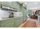 This well-lit kitchen features ample counter space, neutral cabinets, and stainless steel appliances at 2660 Peachtree Rd # 6A, Atlanta, GA 30305