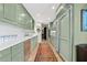 Bright kitchen with stainless steel appliances, long countertops, and seamless connection to dining area at 2660 Peachtree Rd # 6A, Atlanta, GA 30305