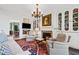 Cozy living room area featuring built-in bookshelves, a fireplace, and plush seating at 2660 Peachtree Rd # 6A, Atlanta, GA 30305