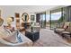 Spacious living room with hardwood floors, elegant furnishings, and access to a private balcony at 2660 Peachtree Rd # 6A, Atlanta, GA 30305