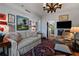 Comfortable living room with a sofa, armchair, and television with an adjoining view of kitchen at 2660 Peachtree Rd # 6A, Atlanta, GA 30305